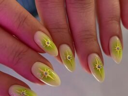 Green ombre almond nails with gold starburst rhinestone accents