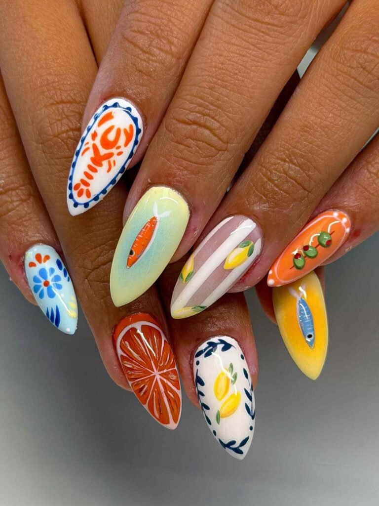 Mediterranean-themed nail art featuring shrimp, fish, lemon, and olive designs