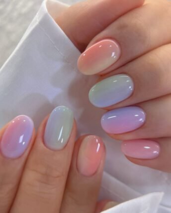 Glazed jelly manicure with translucent pastel colours on each nail