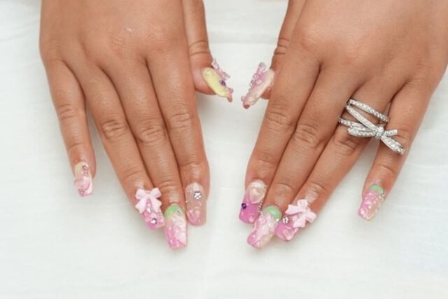 Nails decorated with 3D crystal and pearl embellishments