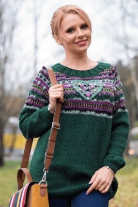 Woman wearing a sage green cotton-blend knit sweater styled for a mild fall morning