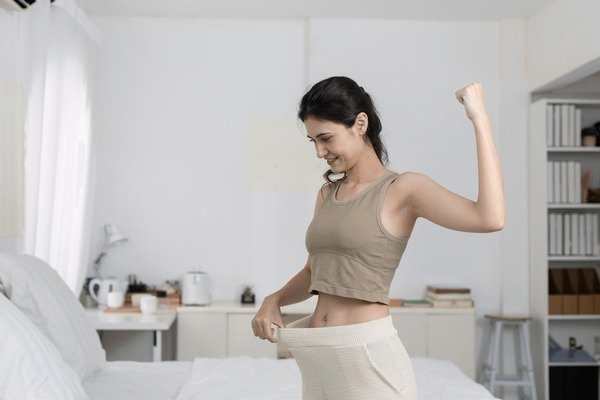Woman doing a home trouser fit check