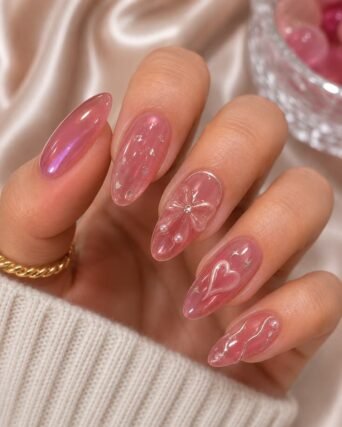 3D chrome nail art with heart and flower details