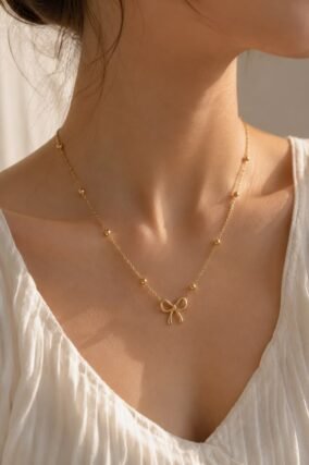 Dainty gold charm pendant necklace on thin chain