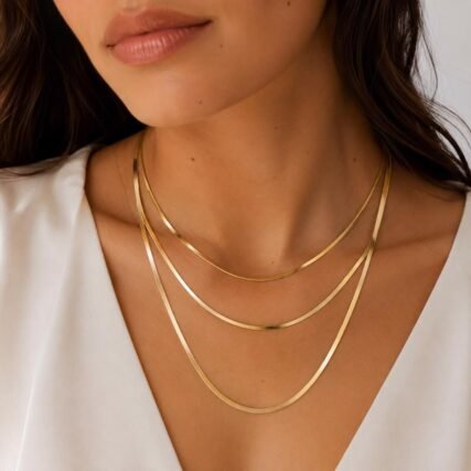 Layered thin herringbone gold chain necklaces