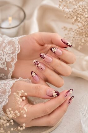 Cream and burgundy floral mismatched nail design