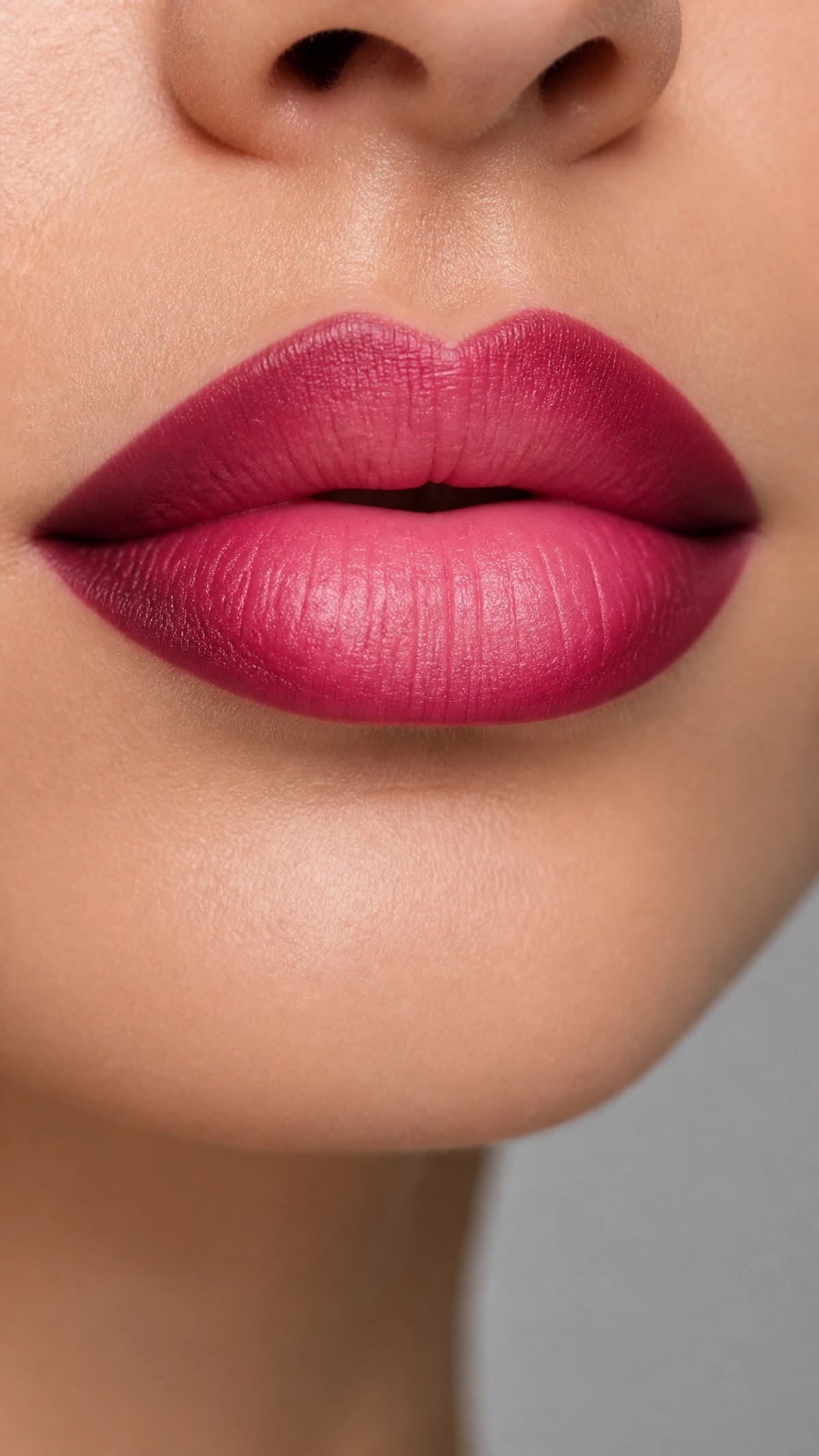 Ombre winter lip look created by layering two lipstick shades