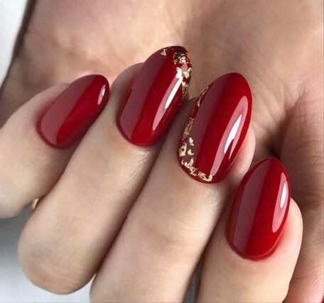 red nails gold foil accent manicure