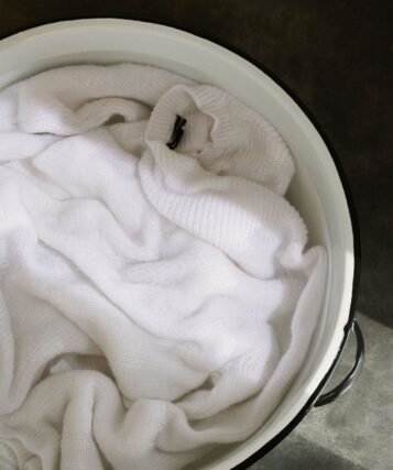 Care label inside a merino wool sweater: hand wash cold, do not tumble dry, dry flat in shade